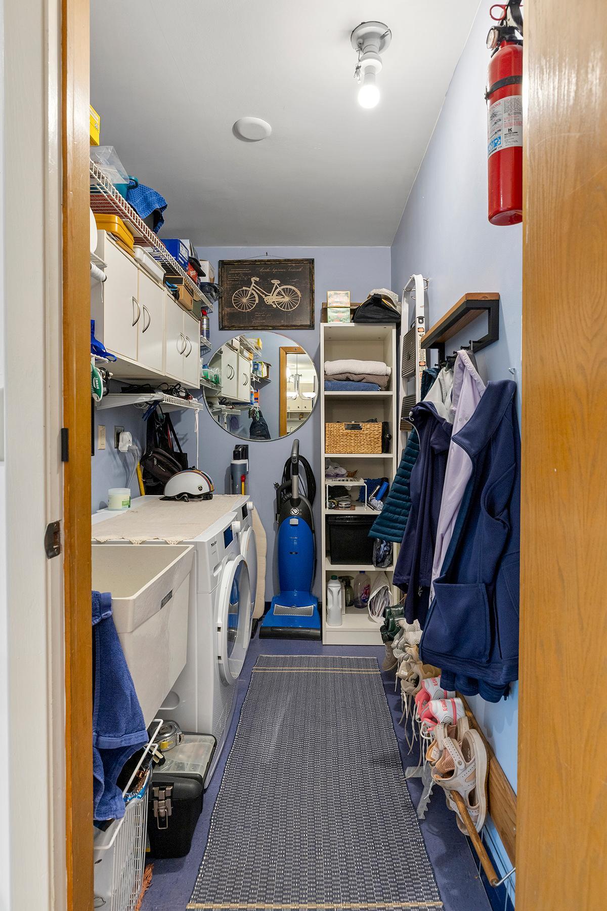 Laundry in the unit! Plus room for coats, shoes, vacuum, and more.