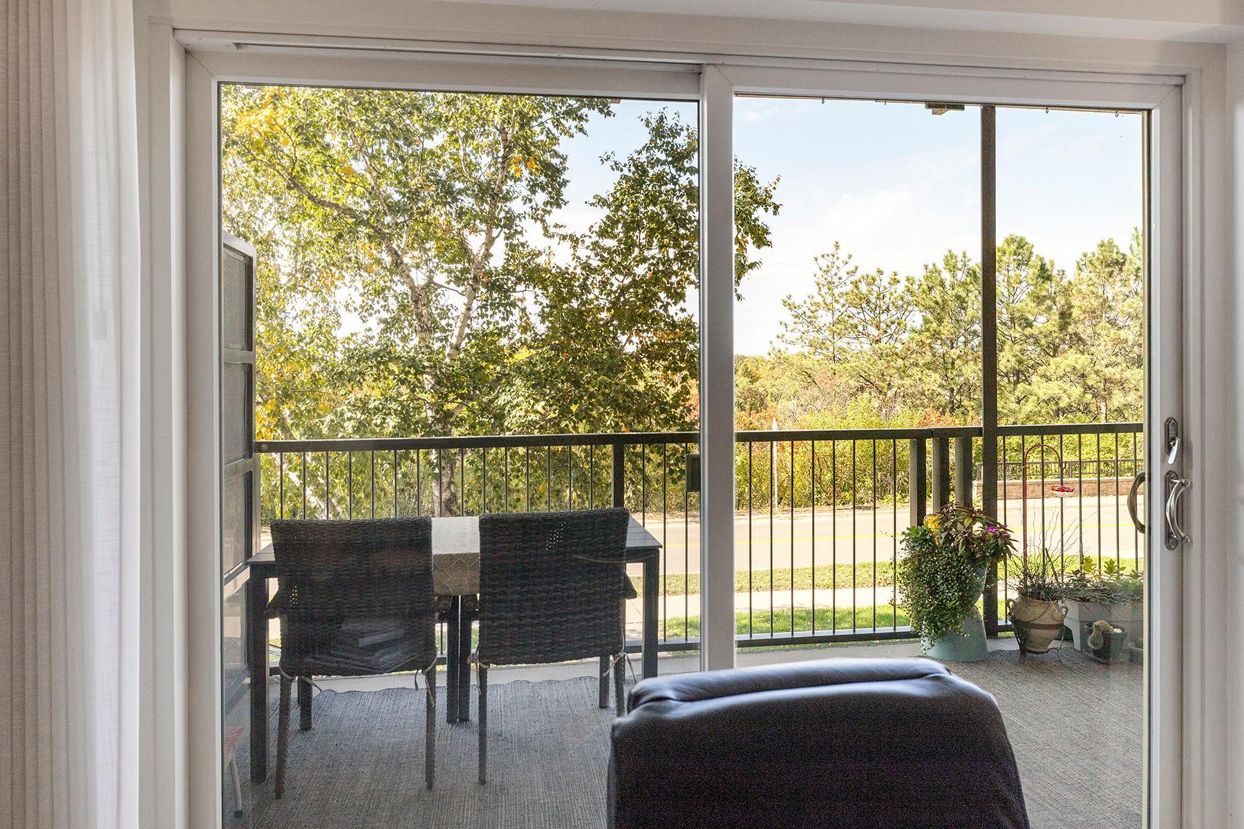 View from living room, looking out to private balcony.
