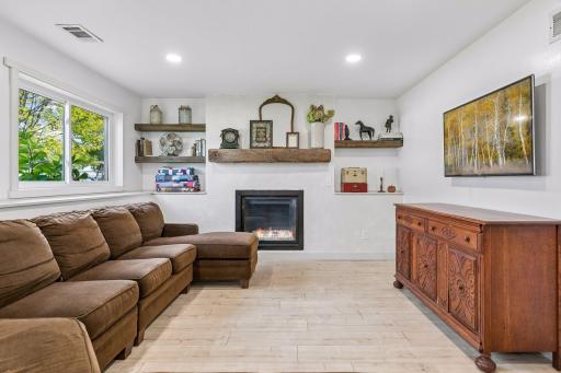 Lower level family room offers warmth, light, and comfort.