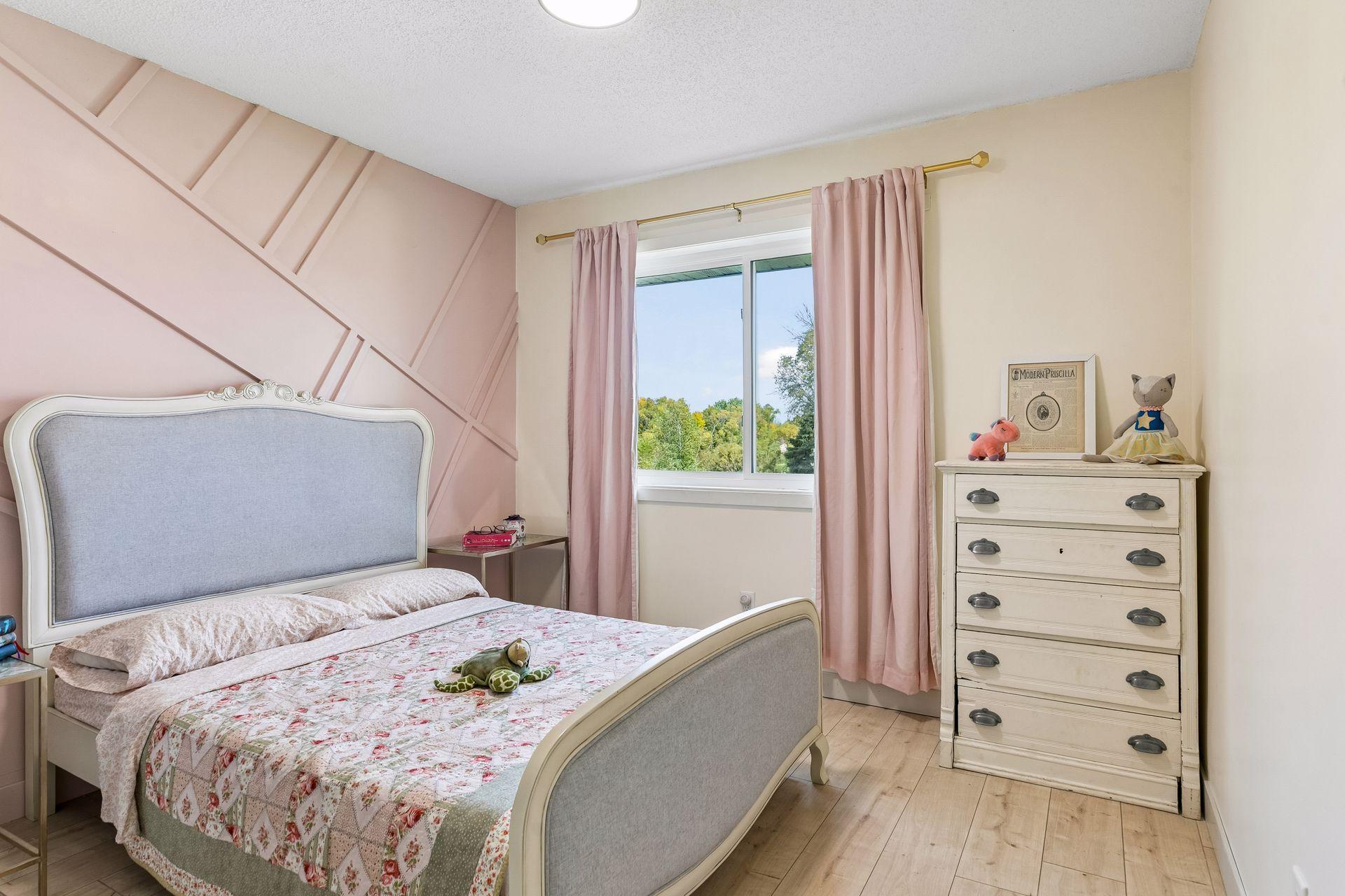 Upper bedroom sure to make your daughter happy. But don't worry, this is not bubblegum pink. 10x11.