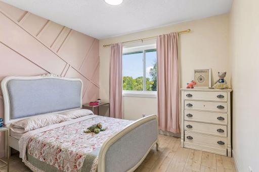 Upper bedroom sure to make your daughter happy. But don't worry, this is not bubblegum pink. 10x11.