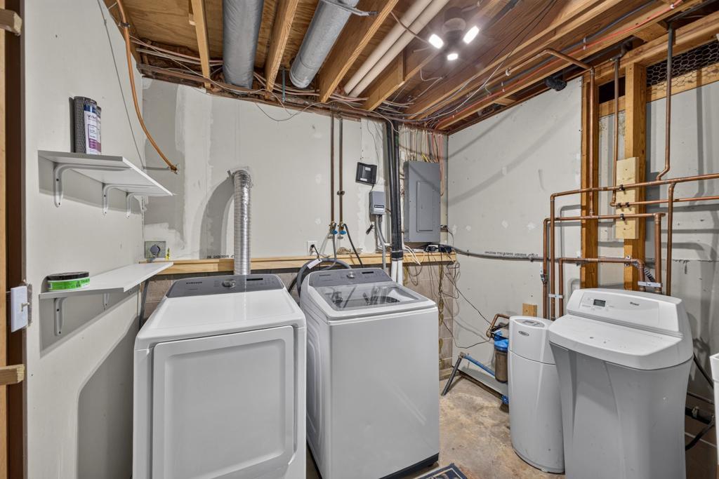 Newer washer and dryer in the large utility room.