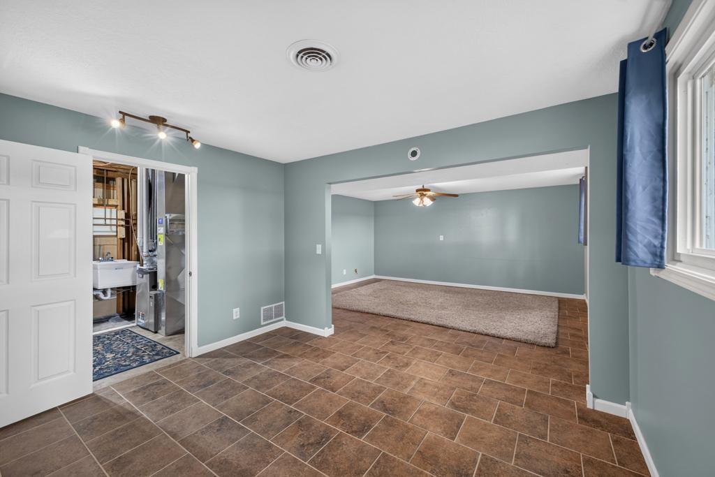 This additional room could be used for an exercise room or would be great for a pool table!
