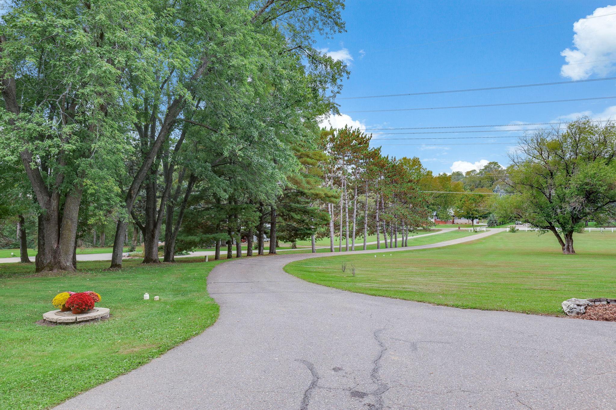 Long winding blacktop driveway. Very private.