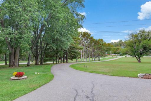 Long winding blacktop driveway. Very private.