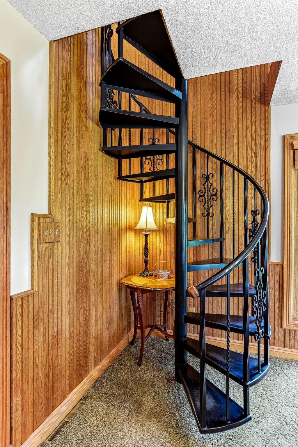 secondary stairs to loft area. Spiral staircase.