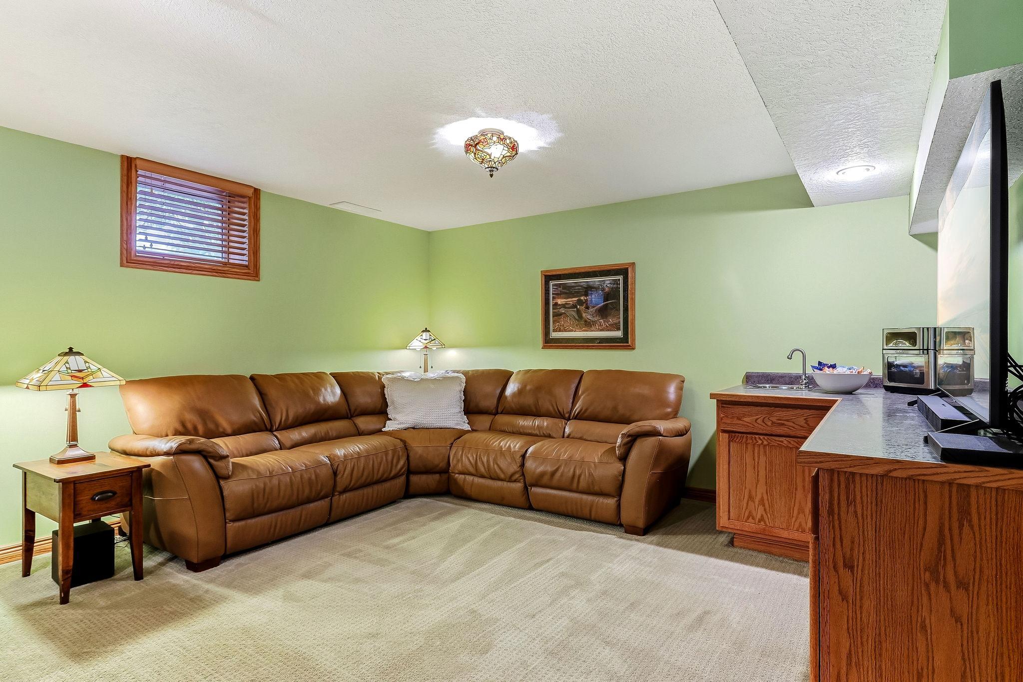 Lower level rec area with great seating for movies and games