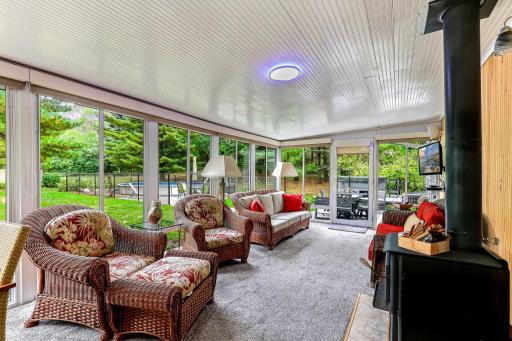 3 season porch with fireplace. Great gathering space looking over private back yard.