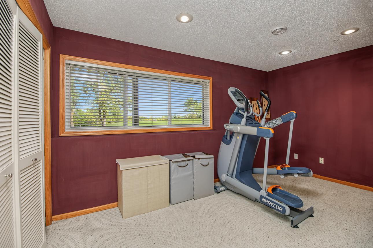 These units offer an additional living space (or in this case an exercise space) in the lower level. Laundry, under stair storage and garage access are also on this level.