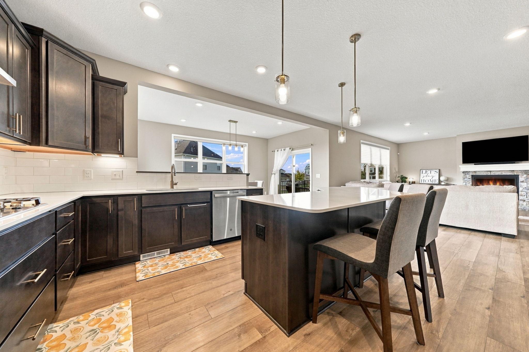 Kitchen opens up to the morning room. So much natural light flowing in!
