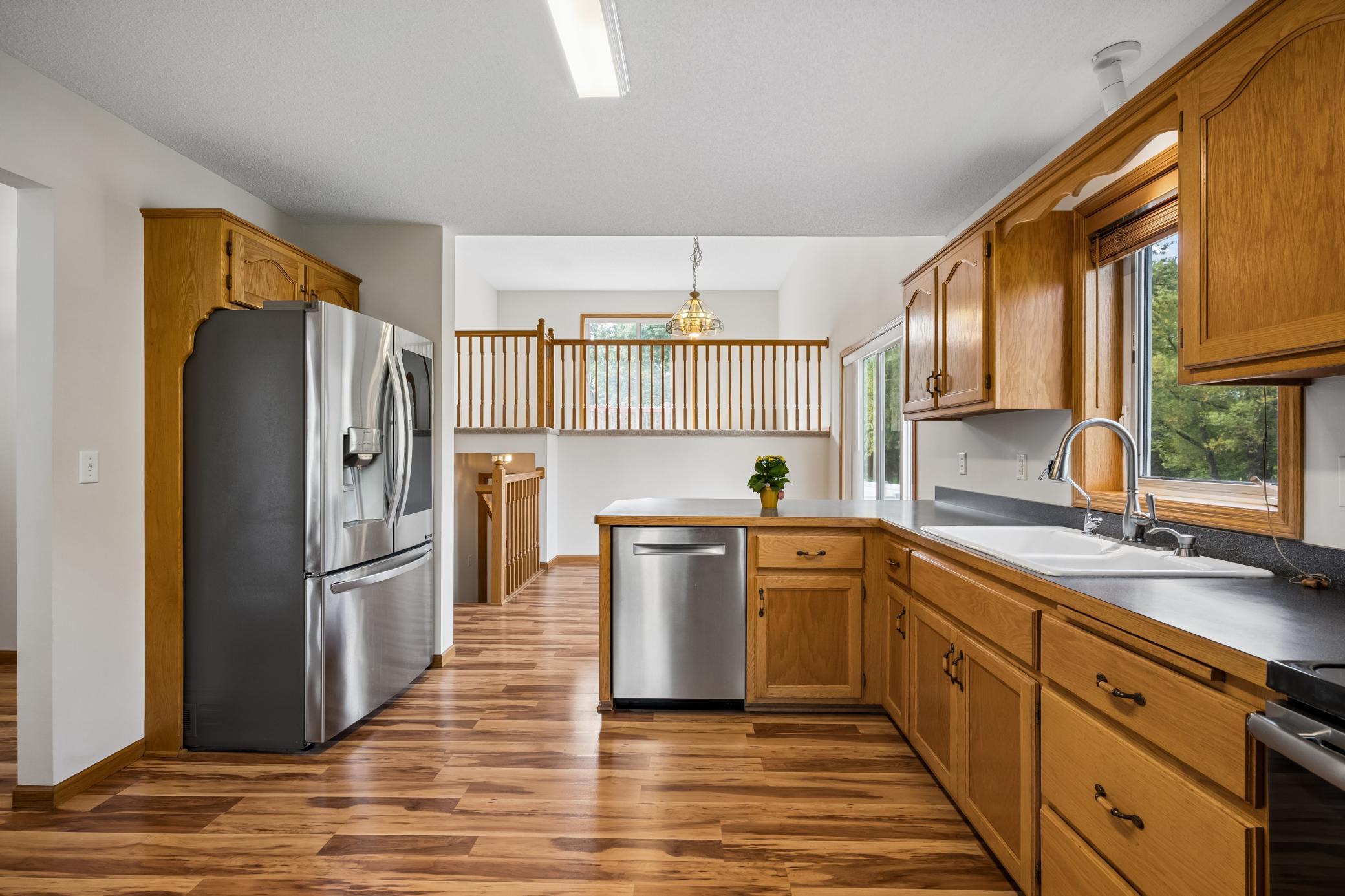 Gorgeous hard wood floors through out the main level. Spacious kitchen with upgraded stainless steel appliances.