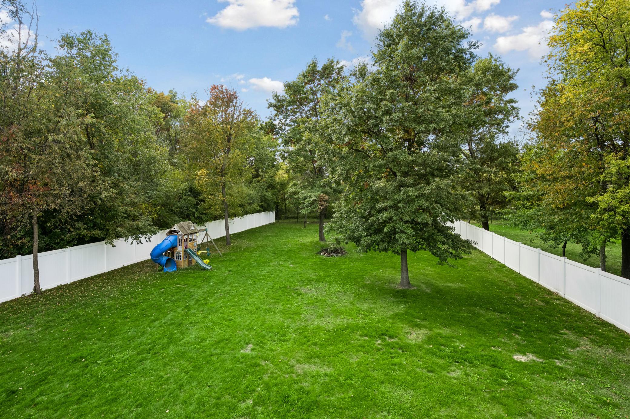 Fully fenced-in .46 acre private backyard sanctuary with mature trees.