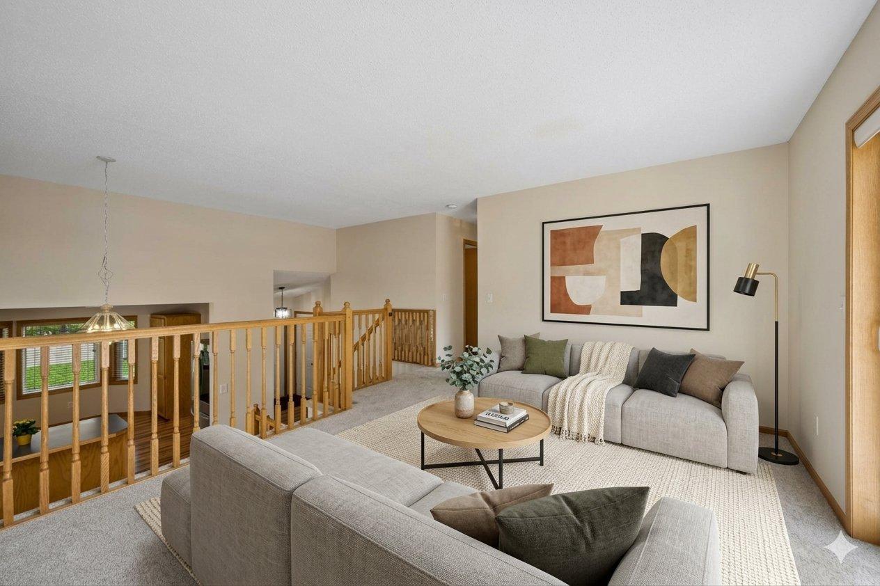 Virtually staged upper level living room with new carpet and freshly painted.