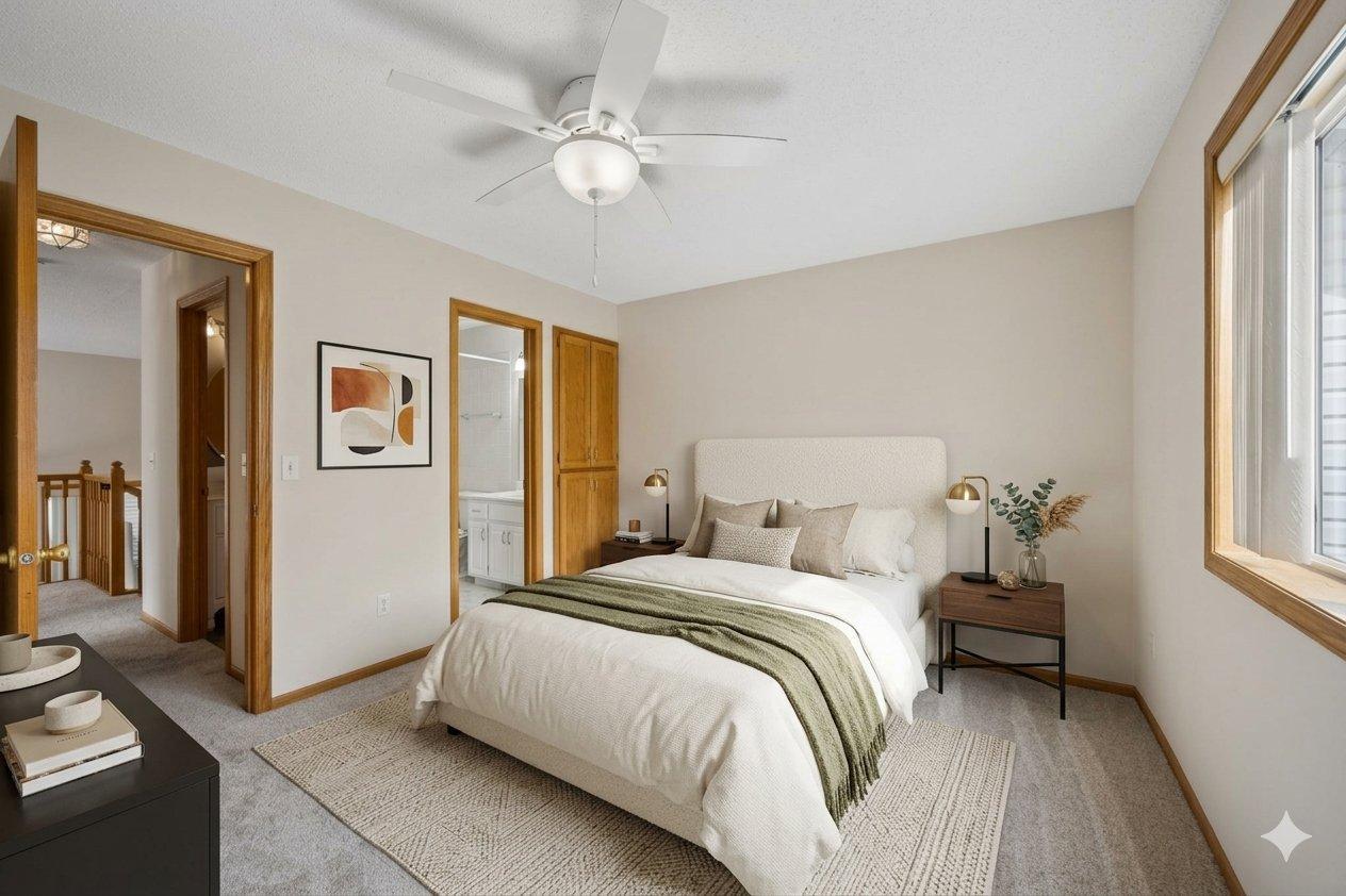 Virtually staged owner's suite with walk through bathroom and walk-in closet.