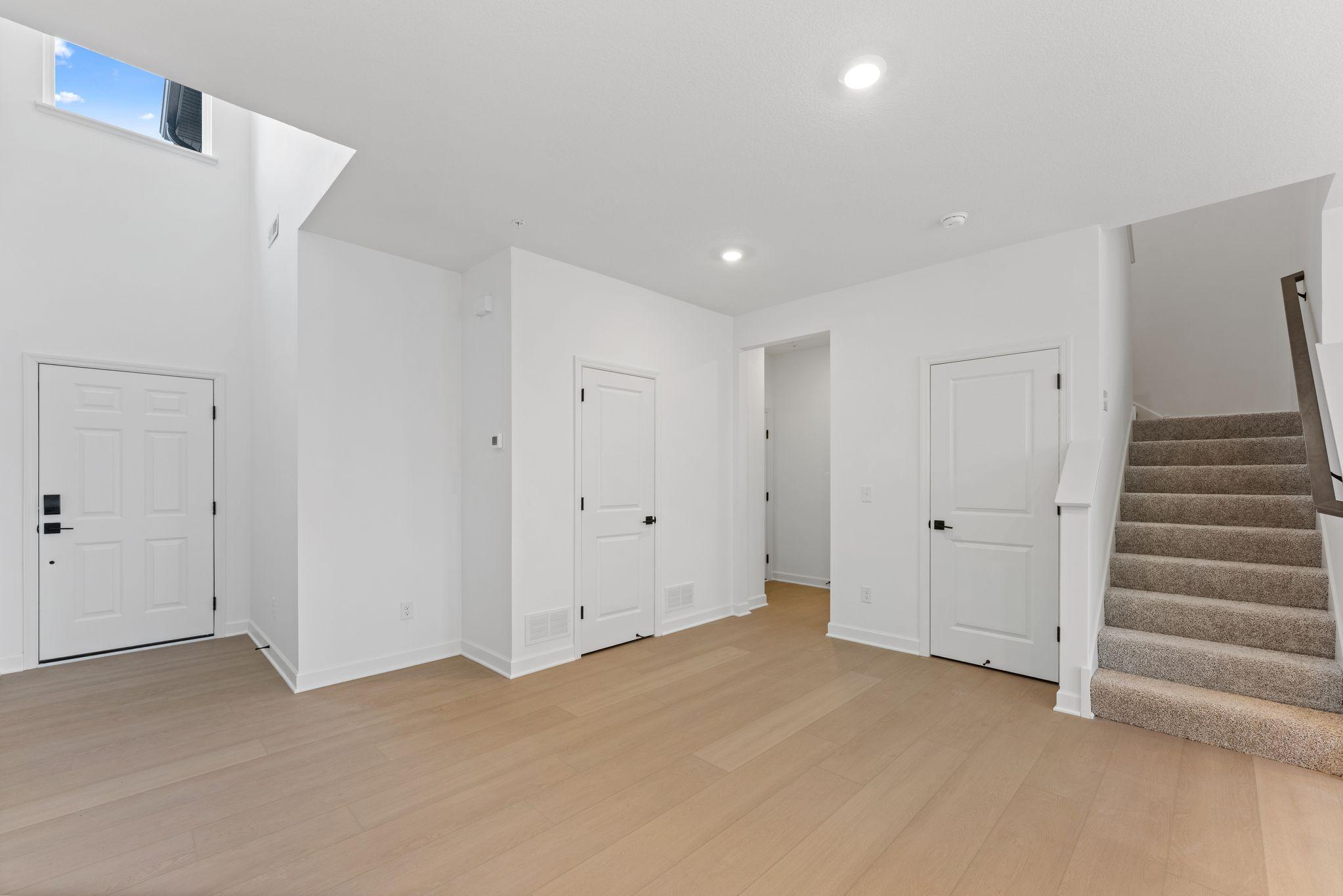 (Photo of a similar home, actual finishes may vary) The open concept floorplan allows for ease of access to all main level living spaces