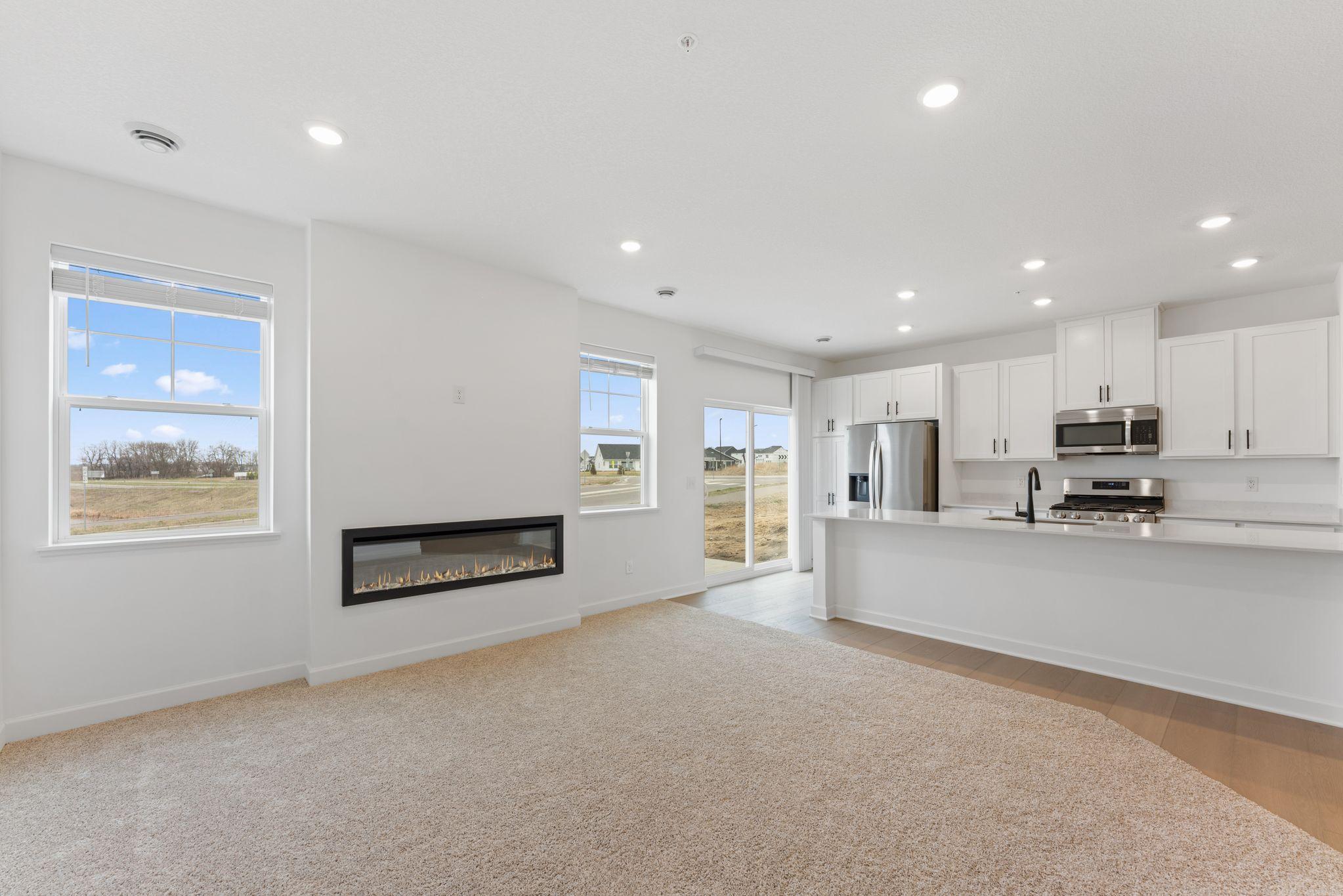 (Photo of a similar home, actual finishes may vary) Residents can venture to the kitchen for quick snacks and drinks during movie marathons
