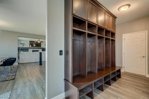 Functional mudroom seamlessly connects to a hidden pantry and built-in command center for effortless everyday living!