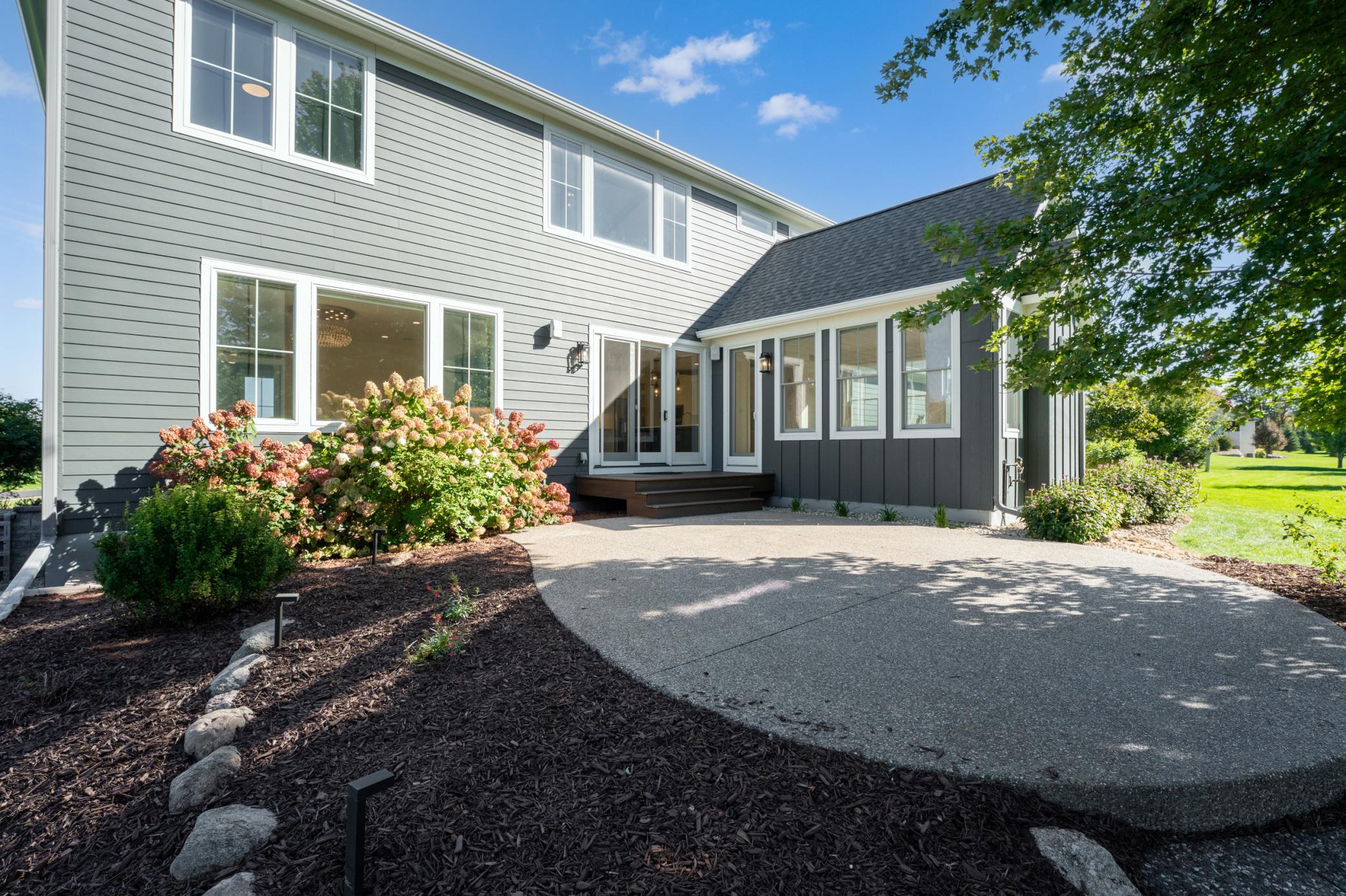 Back Patio with Access to Sunroom & Dining Area
