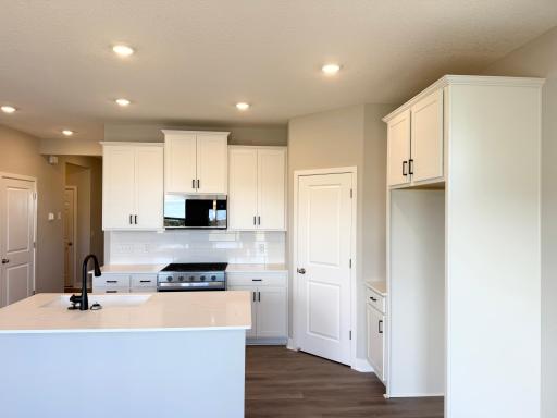 Photo From Actual Home: This home includes a large walk in corner Pantry.