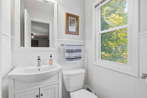 Private 1/2 bath with a nice window and bright lighting.