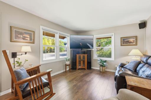 Living room has plenty of windows allowing natural light to flow in.