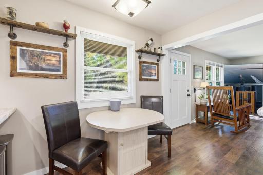 Dining area with views to both the kitchen and living room,.