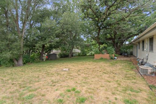 Mature trees create a private, peaceful backyard setting while helping to keep the house noticeably cooler on hot summer days.