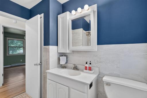 Updated main level bathroom with modern tile work.