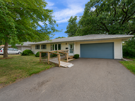 Spacious driveway and attached two-car garage.