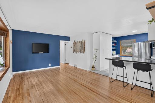 Open living space with hardwood floors and easy flow into the kitchen.