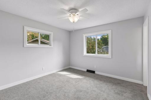 Primary bedroom with private 3/4 bath is one of three bedrooms on the main level