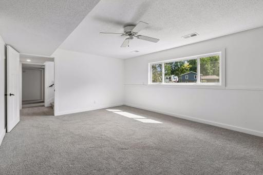 Lower level family room fills with natural light