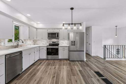 Add a center island to this spacious kitchen