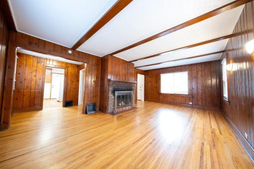 Hardwood floors in the spacious living room and the main floor bedroom