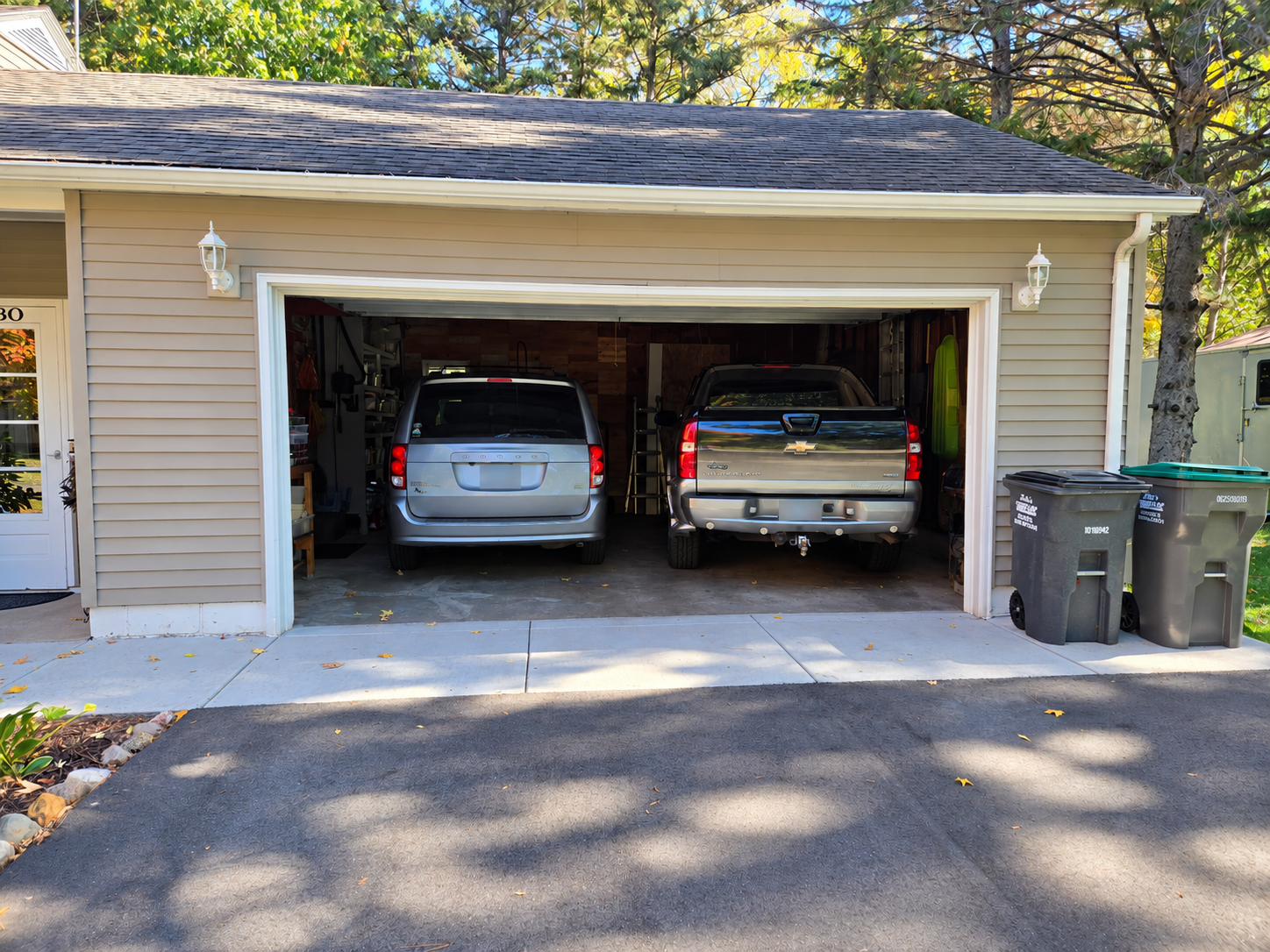 Spacious attached two-car garage with convenient access to the home and additional room for storage.