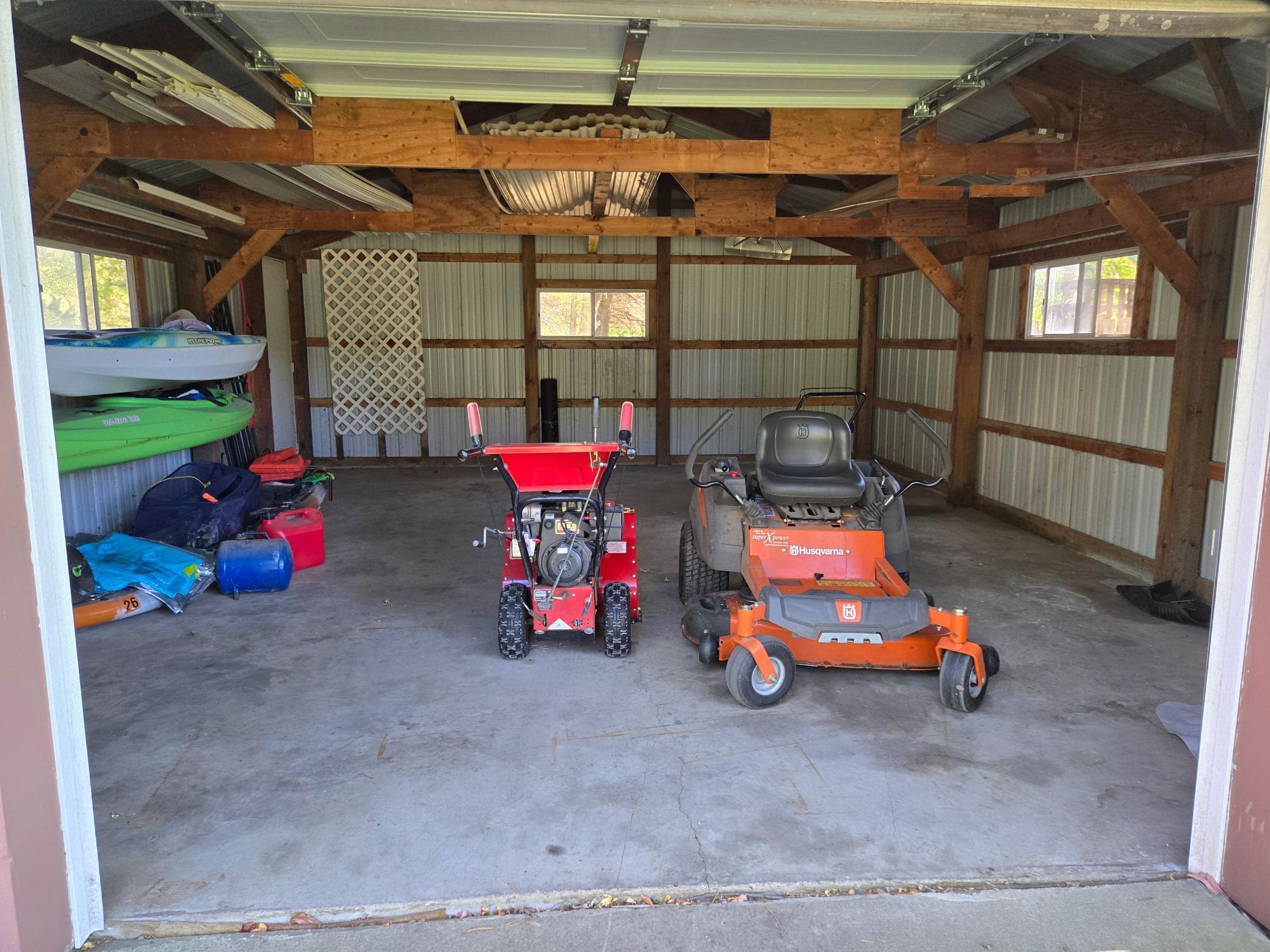 Versatile pole building with concrete floor, ideal for storing lawn equipment, recreational toys, or creating a workshop.