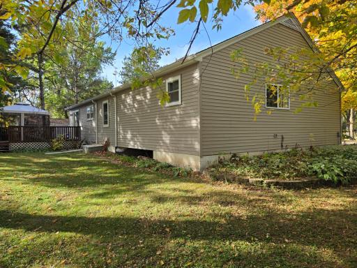 Enjoy the peaceful, tree-lined setting with a spacious lawn, established landscaping, and a deck overlooking the yardâperfect for outdoor relaxation and entertaining.