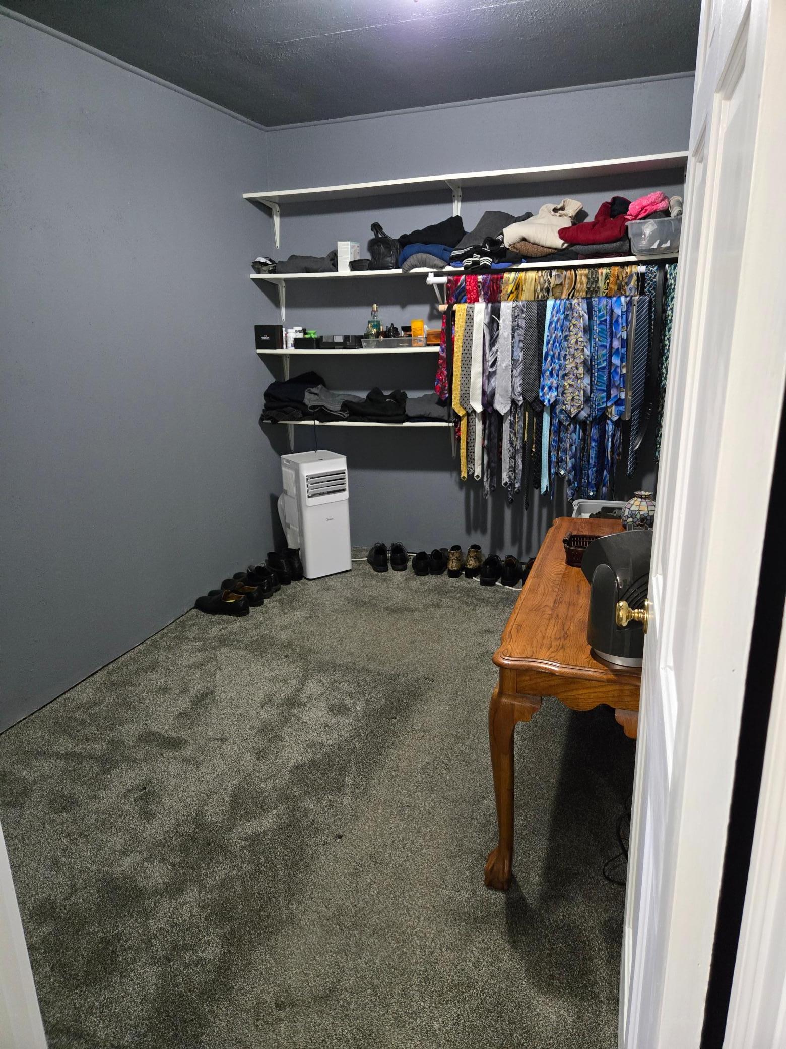 Exceptionally spacious walk-in closet offering abundant shelving, hanging space, and plenty of room for additional storage and organization.