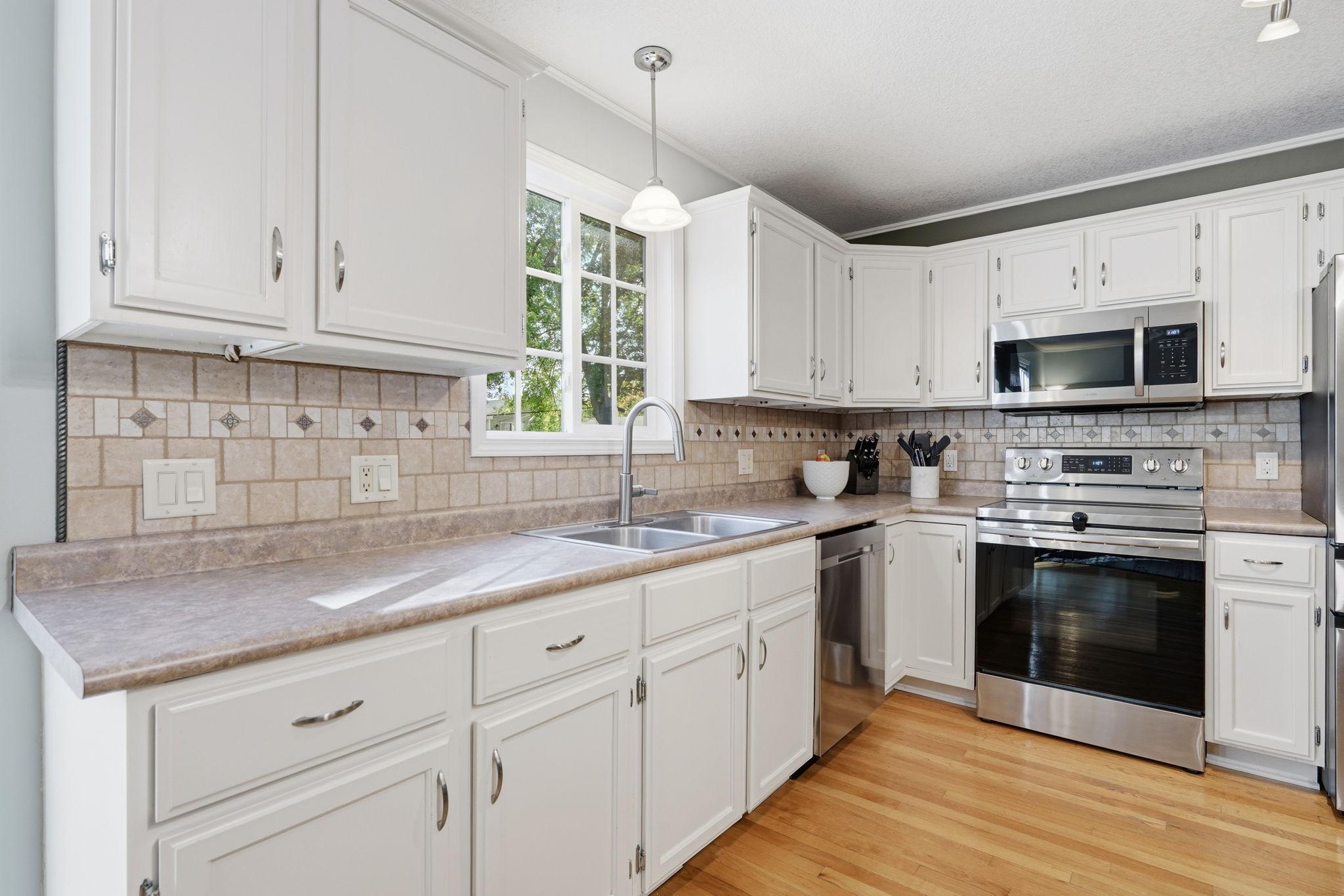 Kitchen offers SS appliances and excellent counter space for prepping your favorite meals... the open main floor is perfect for hosting and entertaining guests