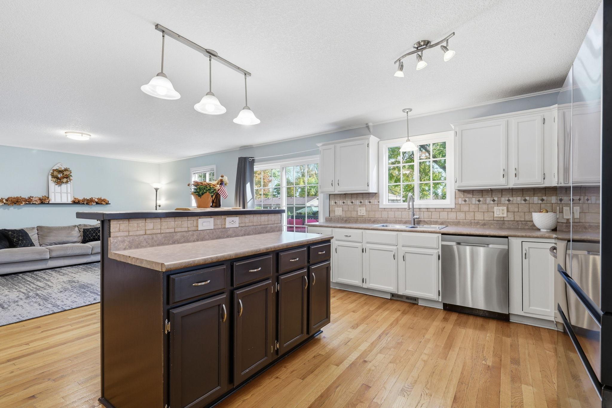 Check out this open main level! Natural light is abundant... open the slider and step out onto your oversized deck area!