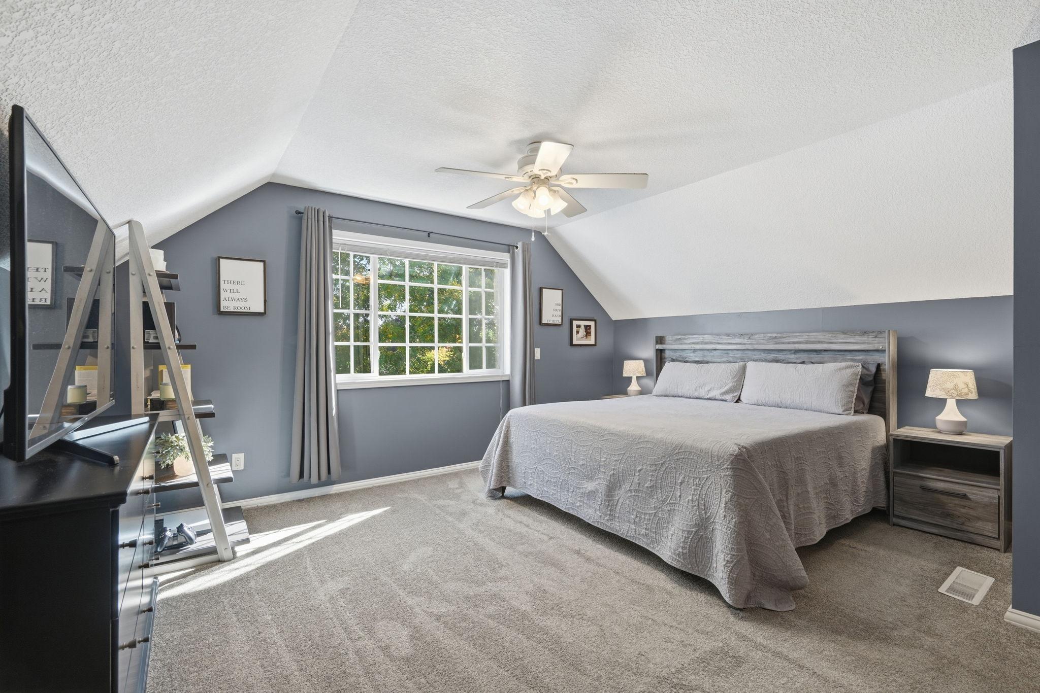 Primary suite is awesome! Vaulted ceiling, fan, lush carpeting, large walk-in closet, and attached full bath! Plenty of room here :)