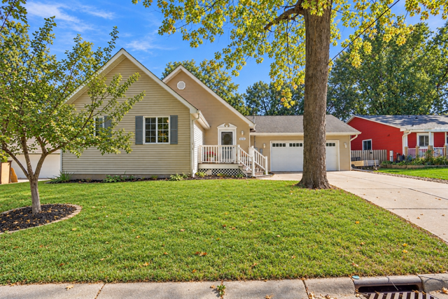 Welcome home!! Charming 1 1/2 story with maintenance free exterior, concrete drive, fenced backyard and the beauty of mature trees!