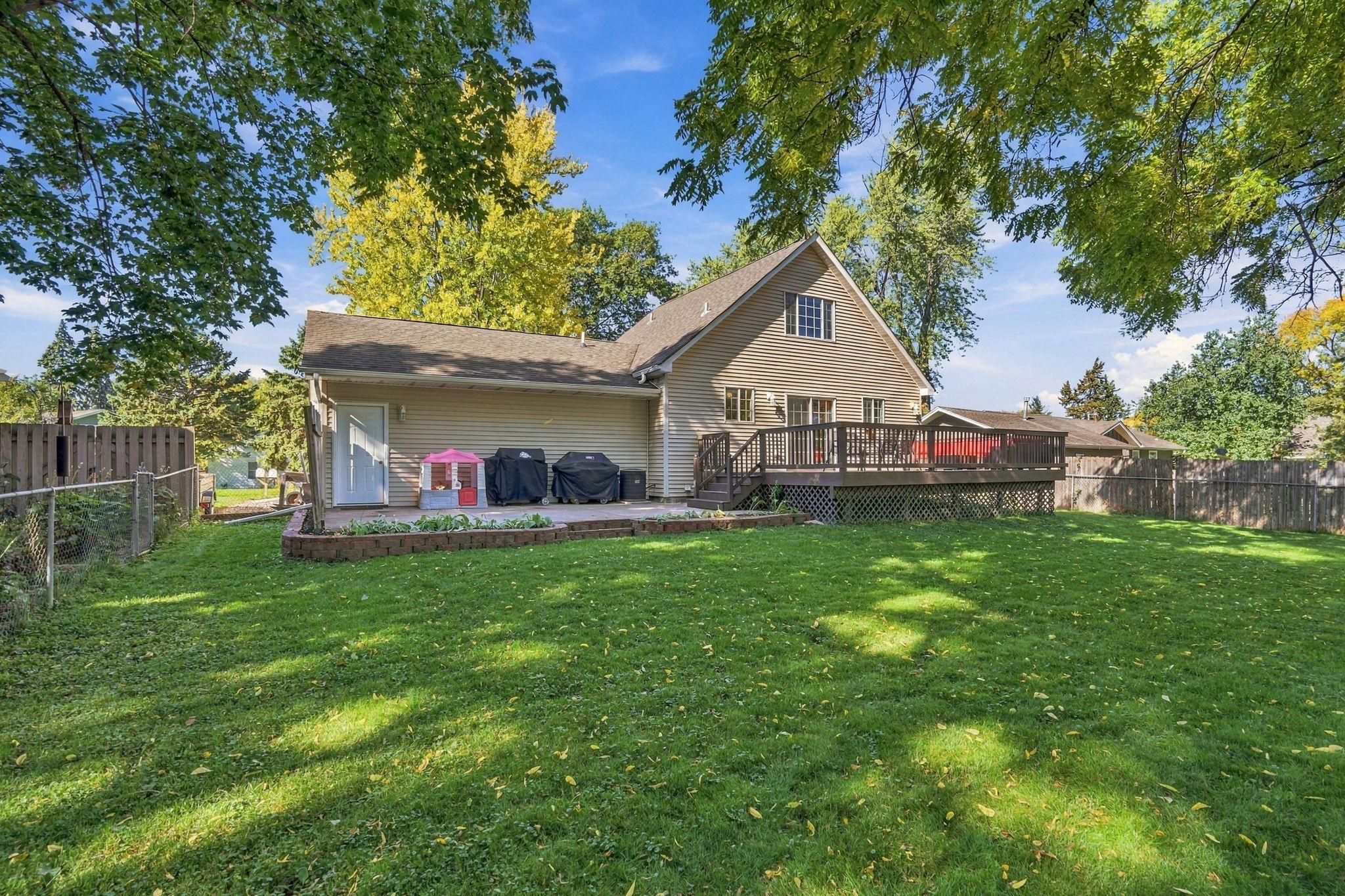 rear view! so much room here to relax in and enjoy! Large deck off the back and patio.. perfect for grilling!
