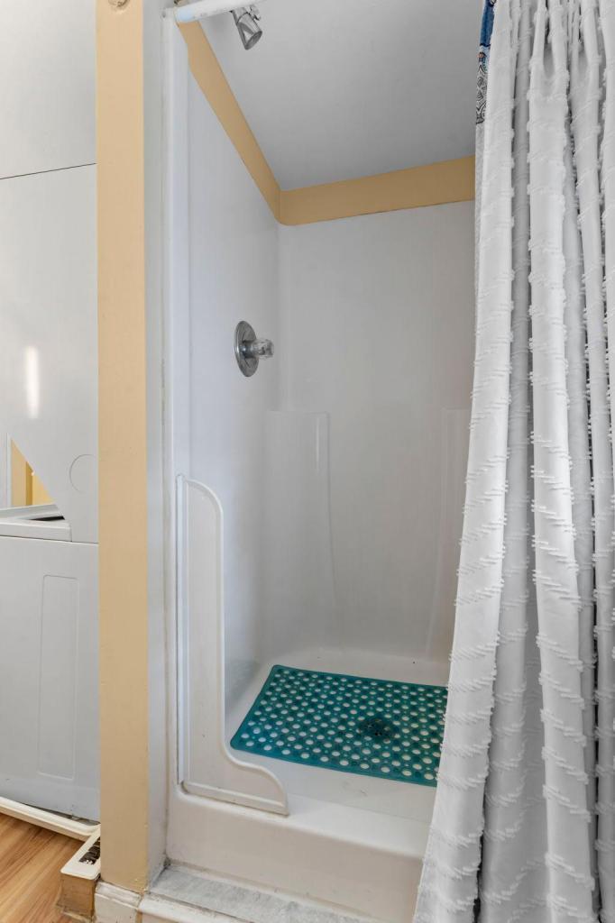 Upper level full bathroom with a separate tub and shower