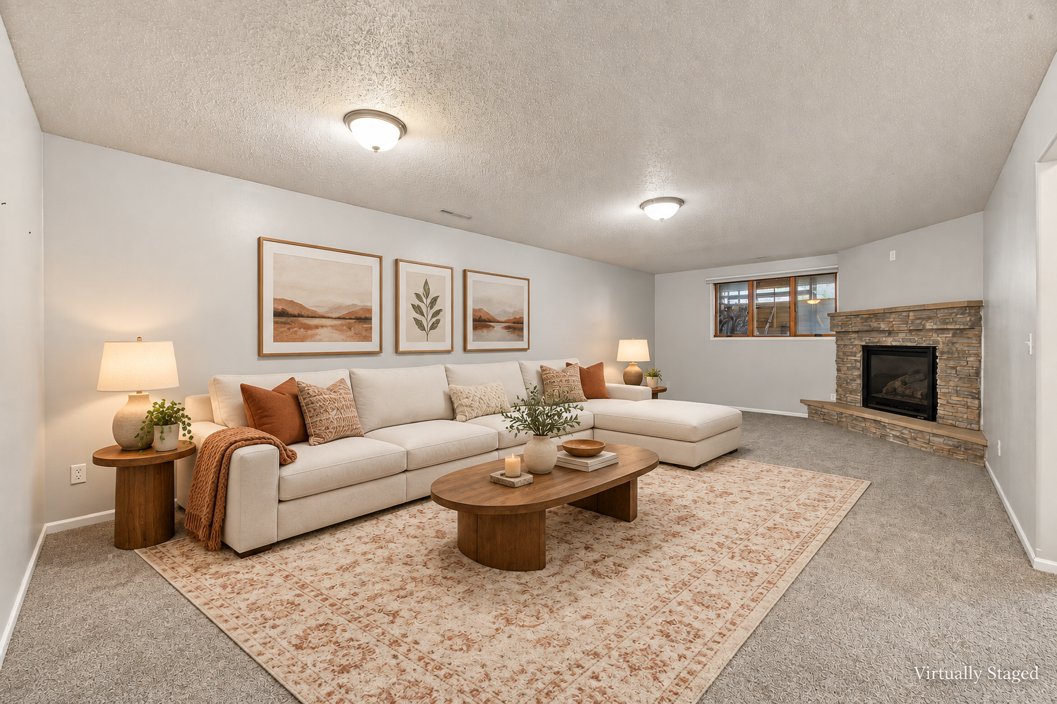 Inviting cream sectional by the fireplace.png
