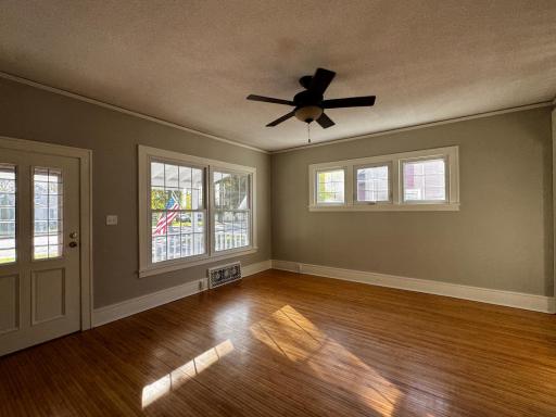 Livingroom with refinished original maple 1 in plank flooring