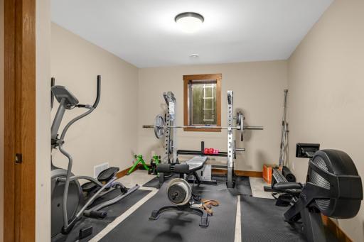 Bedroom 4 of 4 with an egress window is currently used as a gym space