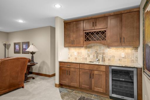 Recreation room with a wet bar and space for a game table