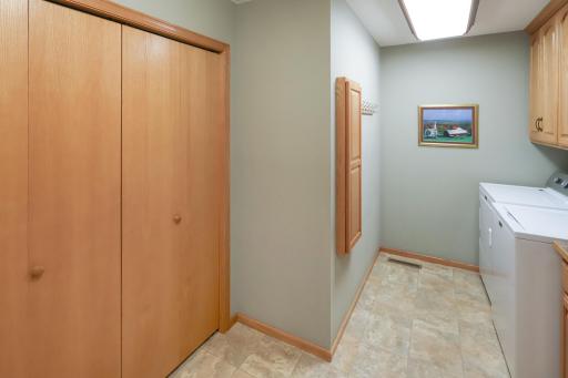 Great laundry and mudroom area with storage and a sink.