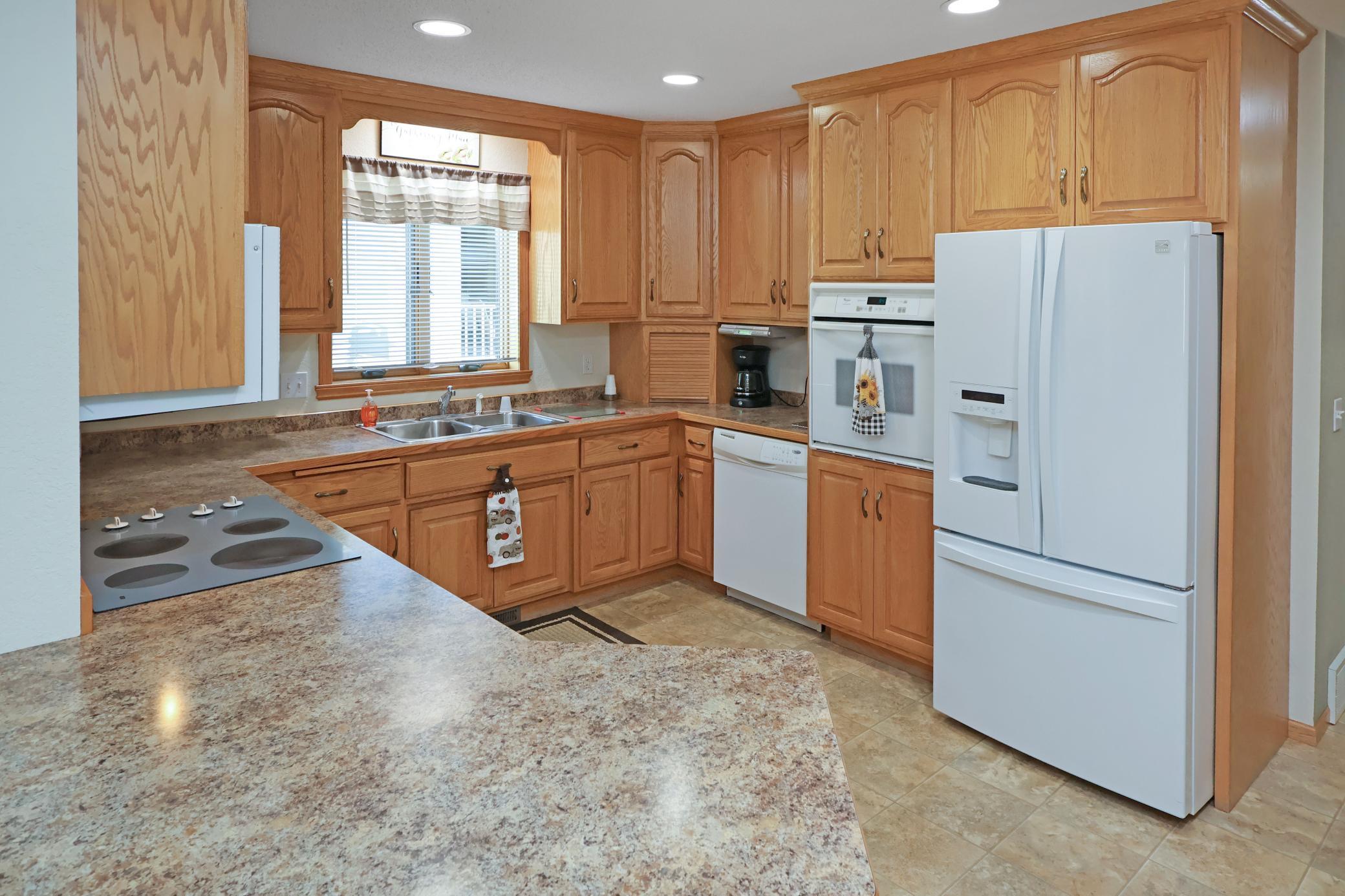Nicely appointed kitchen with 42" uppers and raised panel cabinets.